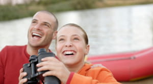 Father and child with binoculars